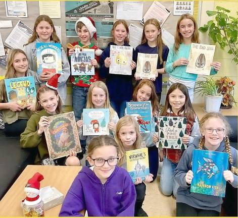 Members of the K-Kids Club at Lounsberry Hollow School read holiday stories to students at Cedar Mountain and Rolling Hills schools.