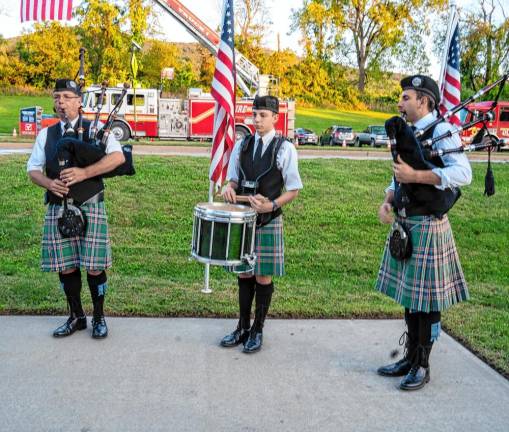 <b>VC3 A.J., Alex and Matthew McCann play bagpipes and drum at the ceremony.</b>