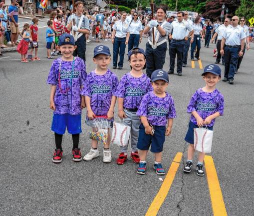 Members of the Huskies softball team march in the Sparta parade. (Photo by Nancy Madacsi)