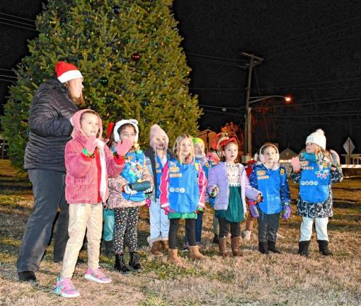 <b>Girl Scouts perform at the tree lighting.</b>