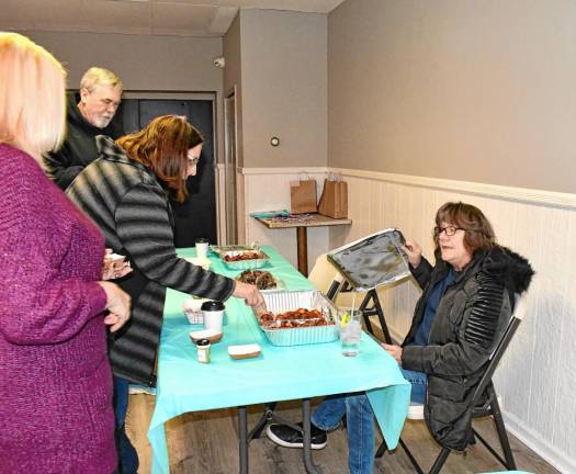 <b>BC2 A woman tastes on of the contest entries.</b>