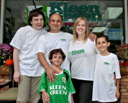 Traci Smith and her husband, Mehdi Ziabakhsh along with their family in front of their new store in Vernon.
