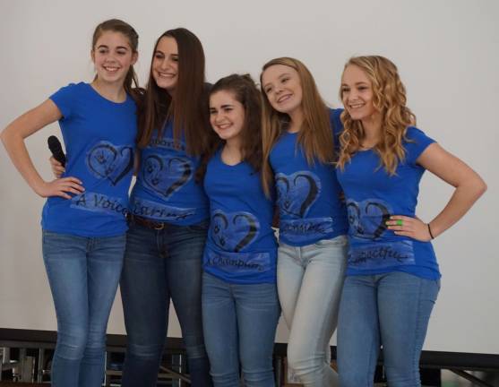 From left, Kaitlyn LaRue, Olivia Fairweather, Caroline Reese, Sydney Hill and Kaitlyn Wunder present assemblies at the Wantage Elementary School.