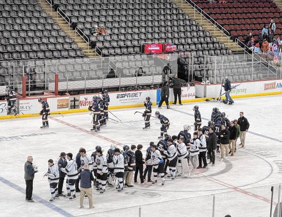 The players congratulate those on the other team at the end of the game.