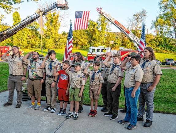 <b>VC1 Boy Scout Troop 404 leads the Pledge of Allegiance at the 9/11 Remembrance Ceremony on Wednesday evening, Sept. 11 in front of the Vernon municipal building. Three Vernon residents - Dorothy Chiarchiaro, Keith Burns and Thomas Linehan - died in the Sept. 11, 2001, terrorist attacks. (Photos by Nancy Madacsi)</b>