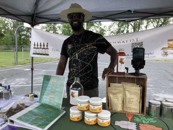 Danny Parrott displays products of his Bergen County-based businesses, Herbal Infusions Kitchen and the People’s Herbalist.