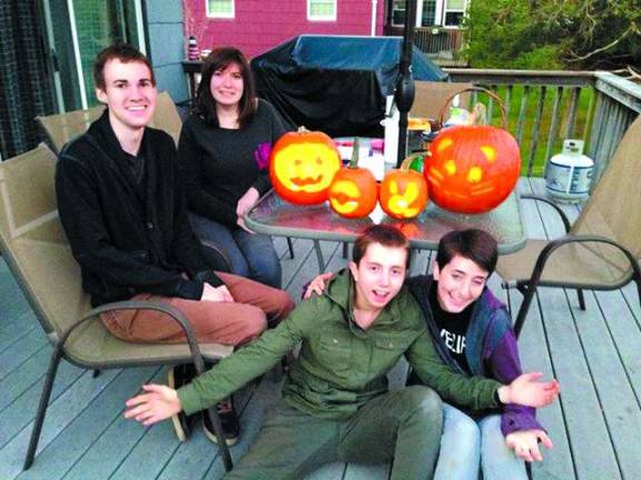 Submitted by Kim Anderson of Glenwood, N.J. Kim Anderson, Emily Hondersheidl, Leanna Malure and Kyle Richard Van Sweden carve pumpkins together.