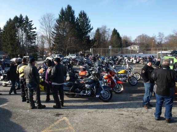 Riders gather in the Ogdensburg Firehouse parking lot Wednesday morning.