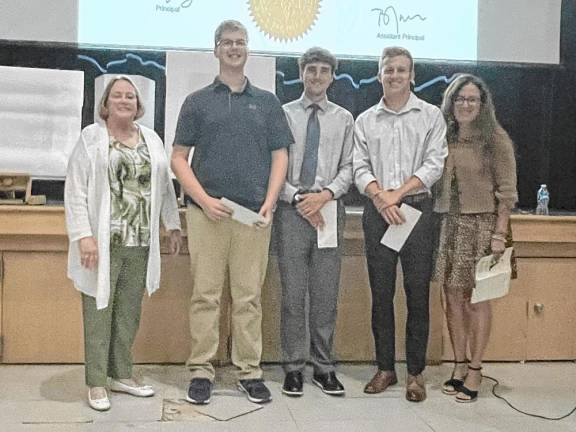 <b>From left, Vernon Township Woman’s Club education chairwoman Valerie Seufert; scholarship recipients Owen Young, Michael Evanick and Zack Mountain; and club member Lisa Murphy. (Photos provided)</b>