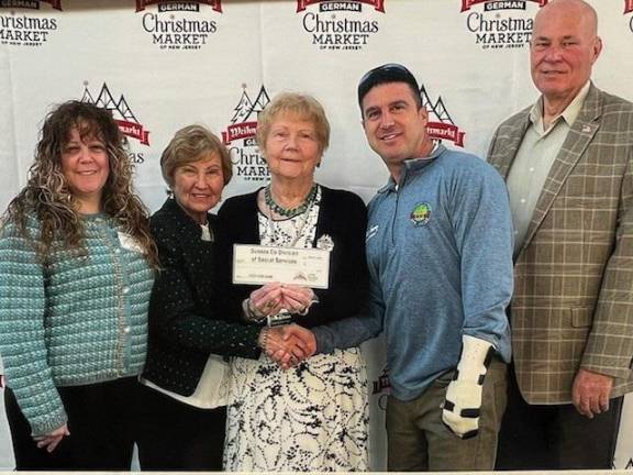 <b>From left are Christine Florio, Sussex County Health and Human Services administrator; Karin Meyer and Gudrun Rank, both founders of the German Christmas Market of New Jersey; Chris Carney, Sussex County Board of County Commissioners director; and Commissioner Alan Henderson. The county Division of Social Services received a $2,000 grant from the market to support its food pantry. (Photo provided)</b>