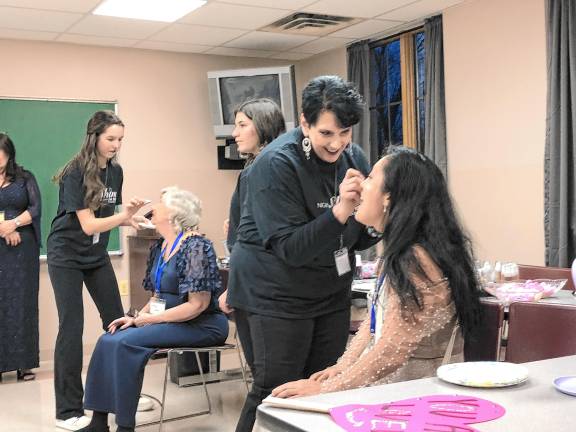 <b>Guests are made up before the Night to Shine event last year at St. Francis de Sales Church in Vernon. </b>