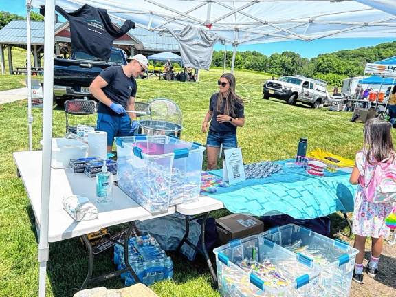 Orthodontist Krystian Jarosz and registered orthodontic assistant Lisa Campbell of Skylands Orthodontics give out cotton candy and items such as toothbrushes and a rainbow tooth bubble popper. (Photo by Daniele Sciuto)