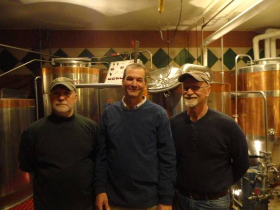Krogh's brewers David Cooper and Bud Usinowicz with owner Bob Fuchs in the brewery.