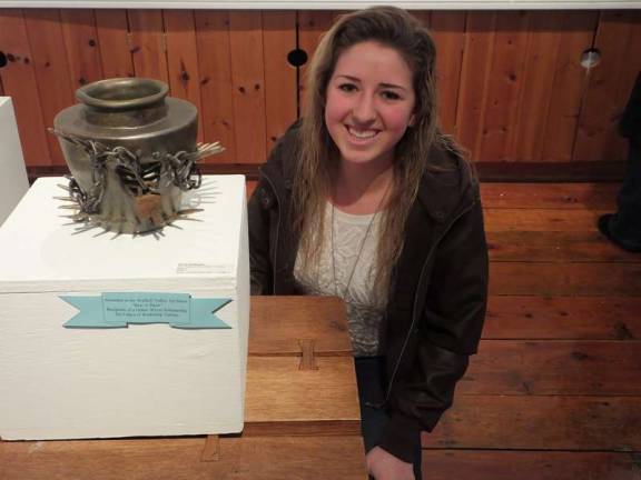 Wallkill Valley Regional High School art student Nicole Bauberger poses next to her clay fired pot which won &quot;Best in Show&quot; at the Wallkill Valley Art Show.