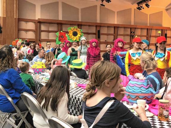 The cast of the Sparta Middle School musical ‘Alice in Wonderland Jr.’ performs for guests.