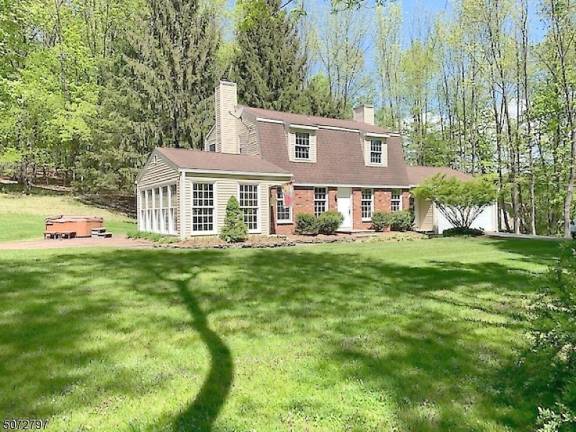 Colonial on 8.5 acres includes horse barn