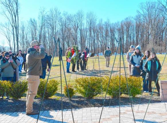 A man salutes after placing a wreath during the ceremony at the Northern New Jersey Veterans Memorial Cemetery in Sparta. (Photo by Maria Kovic)