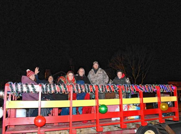 The parade included many decorated firetrucks, ambulances and other vehicles.