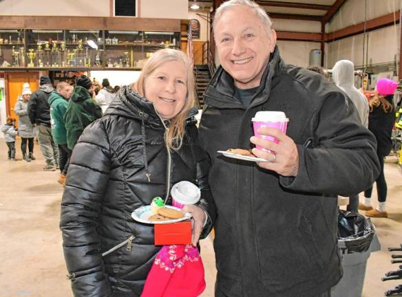 <b>Bonnie and Gregg White with cookies and hot chocolate.</b>