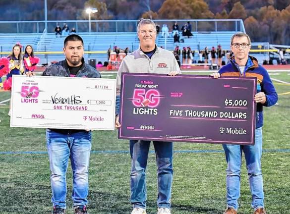 <b>T-Mobile presents a check to Vernon Township High School as part of its Friday Night Lights program. (Photo by Pete Hagedoorn)</b>