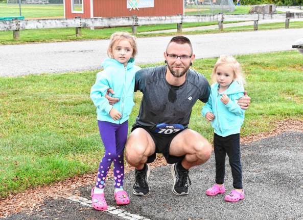 <b>Jordan Snyder with his daughters Emma and Grace.</b>