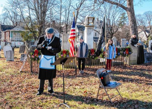 George Stypolkowski gives the invocation at the ceremony in Newton. (Photo by Nancy Madacsi)