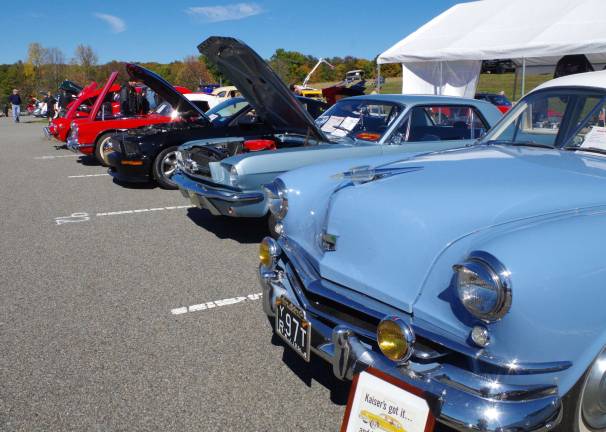 Competing cars are shown lined up in the upper parking lot in this scene at the Eighth Annual Wantage Car and Motorcycle Show.