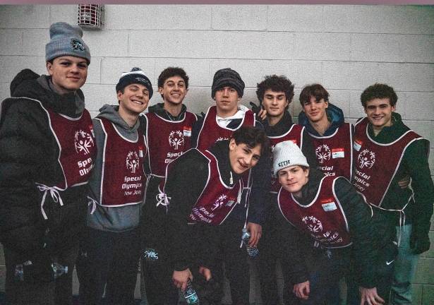 Ramapo High School hockey team members volunteer to help with the Special Olympics.