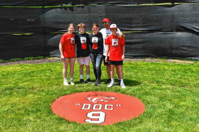 DA2 Mikayla, Chase, Lauren, Ernie and Brady Conklin, all of Wantage, pose by marker with Doc Ayers’ number. Lauren is Ayers’ granddaughter. He died April 1, 2023, at age 92.