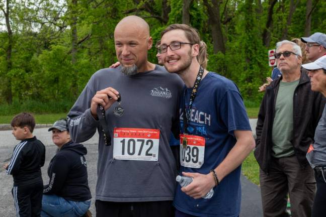 Matt Scialla, left, of Vernon and Kyle Dehn of Glenwood smile for a photo after the 5K. Dehn was fourth and Scialla came in 19th.