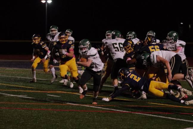 Sussex Tech running back Andrew Baker moves the ball into the open field in the game. Baker rushed for 117 yards and scored a touchdown.