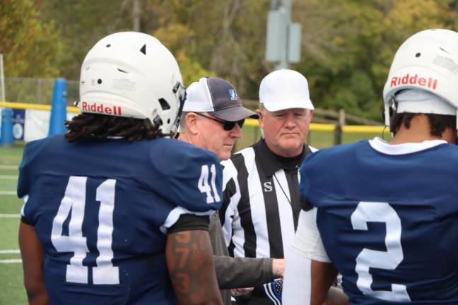 Thomas Ryan, managing partner of the Sparta law firm Laddey Clark &amp; Ryan, tosses the coin before the Skylanders game Sunday, Oct. 15 at Sparta High School. (Photo by Dave Smith)