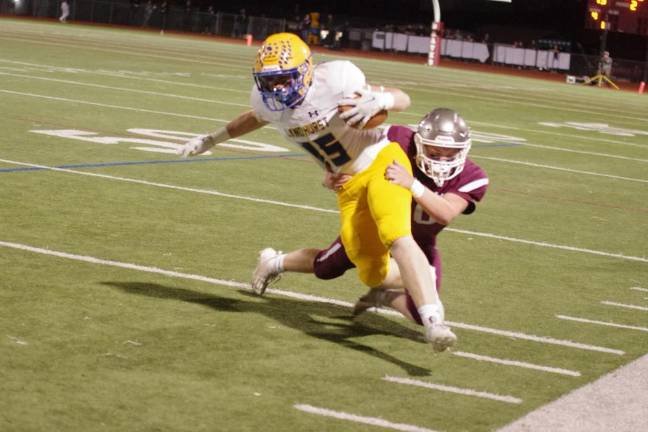 Lyndhurst ball carrier Matthew Jarvis is tackled by Newton defensive back Tommy Carroll in the first half.