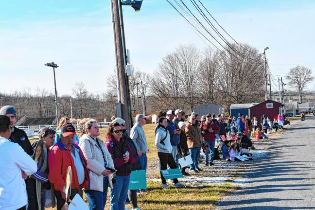 <b>Spectators line the route of the 5K.</b>