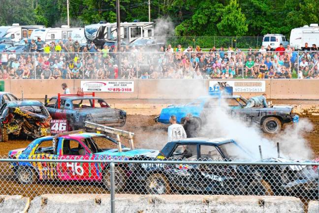 <b>The Demolition Derby on Sunday evening, Aug. 4. (Photo by Maria Kovic)</b>