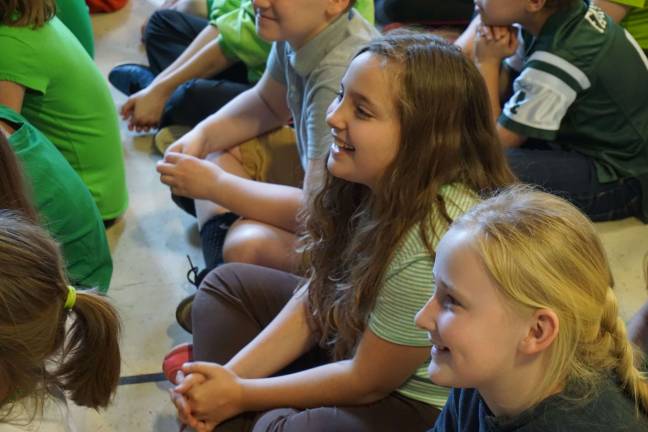 From left, Leah and Rilee enjoy what the eighth-graders prepared for them.