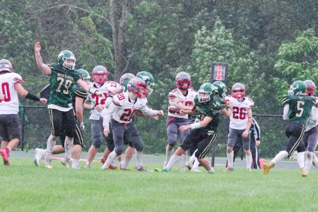 The ball is up for grabs after it was knocked loose from a Sussex Tech running back in the first half.