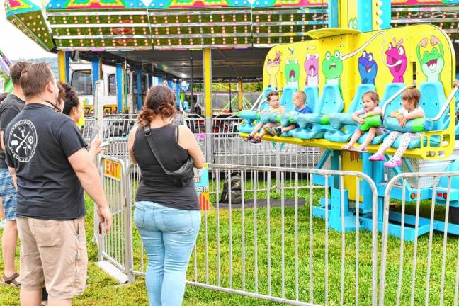 Children are strapped in for a ride.