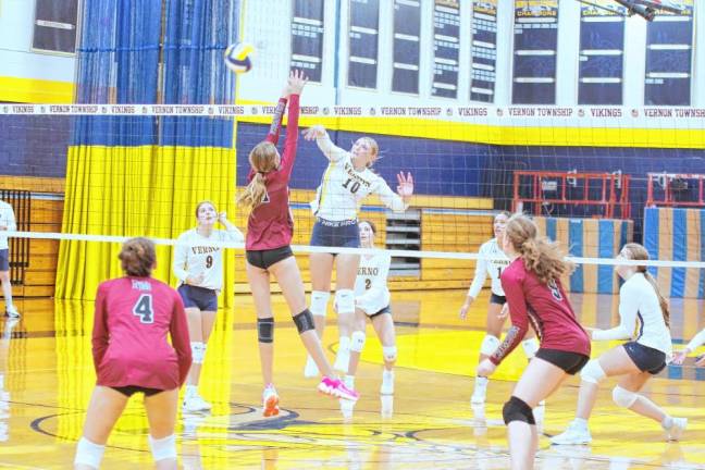 <b>Vernon's Ava Pecoraro (10) strikes the ball past an opponent during the first set.</b>