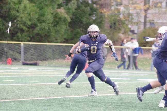 Pope John ball carrier Tyler Houser is on the move.