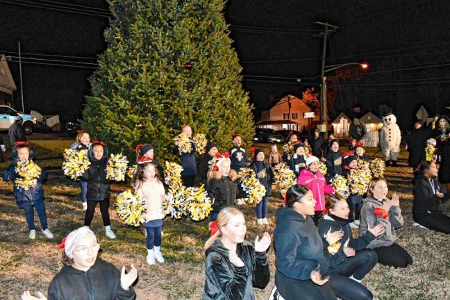 <b>Young cheerleaders perform at the tree lighting.</b>