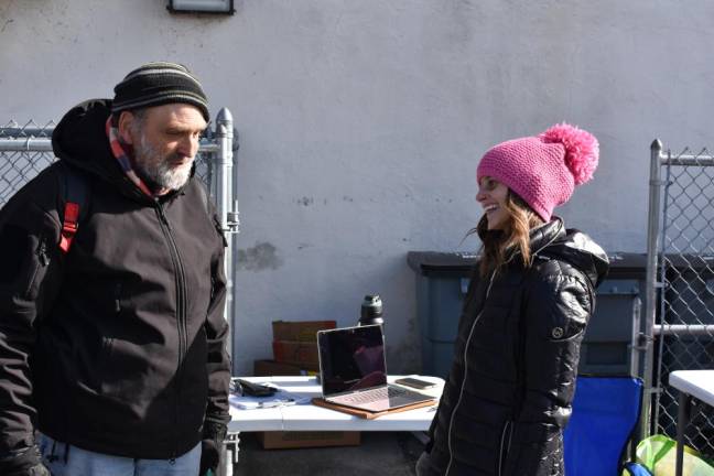 Ed Gould Sr. talks with Marissa DeOliveira, a program development specialist with Sussex County, who is spearheading the county census. (Photos by Becca Tucker)