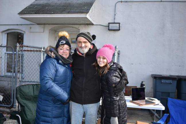 From left are volunteer Cindy Mendoza, Harvest House patron Ed Gould Sr. and Sussex County program development specialist Marissa DeOliveira.