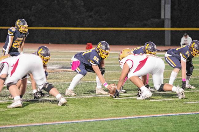 <b>Vernon center Mason Rivera (61) is ready to snap the ball.</b>