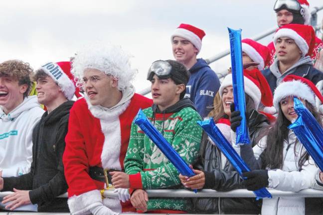 Fans are in the holiday spirit as they cheer on the Pope John Lions.