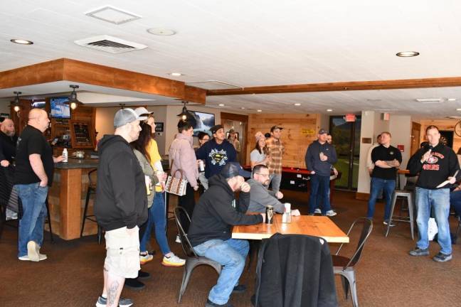 Participants listen to instructions before the tournament begins.