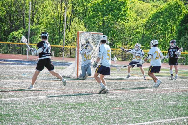 In the fourth period, Delaware Valley's Peyton LaRocco (22) fires the ball, which hits the net, resulting in the 200th goal of his career.