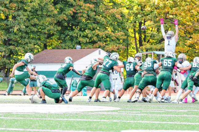 <b>Pope John’s Prince Joshua goes up to block a 50-yard field goal attempt by Delbarton’s Will Kramer at the end of the first half. Kramer kicked two field goals and three extra points in the game. (Photo by Glenn Clark)</b>