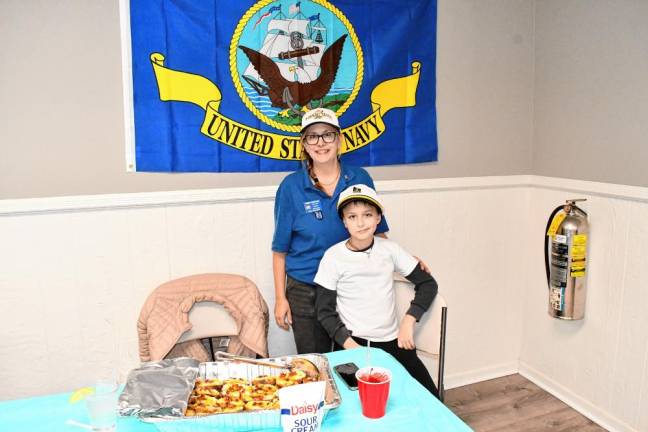 <b>Christy and Sal Guccione win second place for their potato boats with bacon.</b>