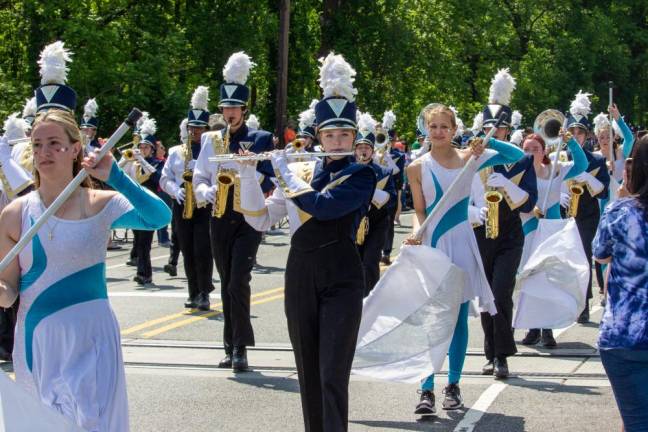 The Vernon Township High School Viking Band marches in the parade along with the color guard.